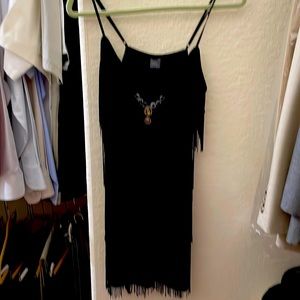 Fun and slinky fringed tank top. And it’s bejeweled!!!  Gently worn.